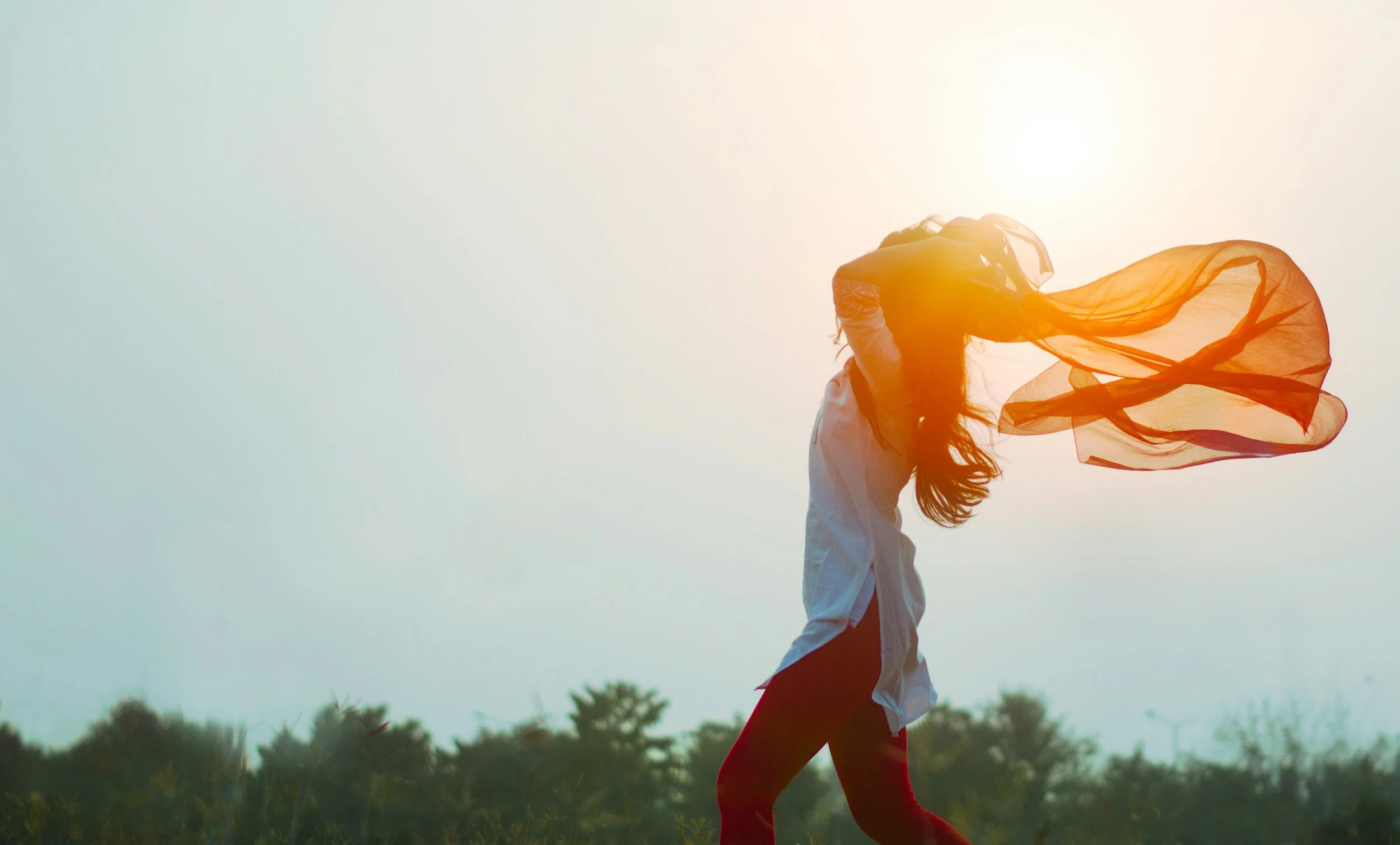 happy woman at sunset
